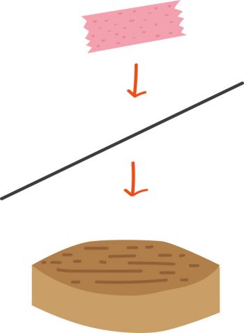 Korkenscheibe mit aufgeklebter Nadel